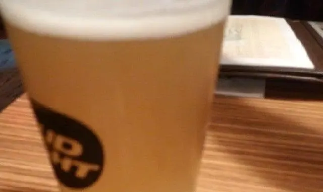 A glass of draft beer on the bar at Bulldogs