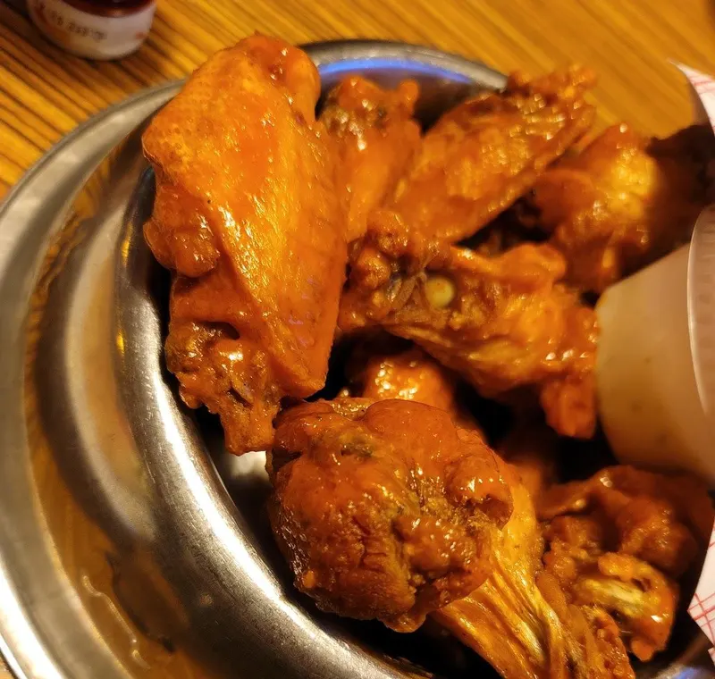 Buffalo wings served in a dog bowl at Bulldogs